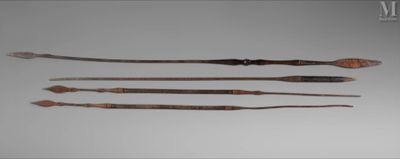 three different types of weapons are displayed on a gray surface