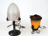 two lamps that are next to each other on a table