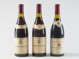 three bottles of wine sitting next to each other on a white surface