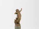 an image of a statue of a child on a pedestal