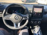 the interior of a car with a steering wheel, dashboard, and touch screen