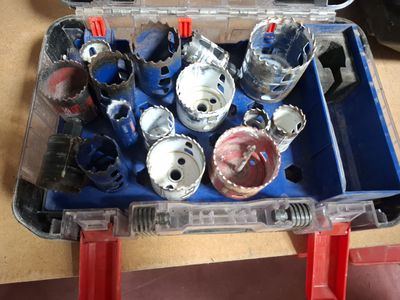 a tool box filled with various tools on a table