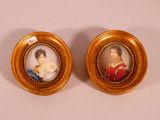 two miniature portraits of a woman and a man in gold frames