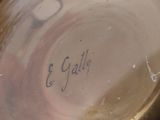 a close up of a silver plate with writing on it