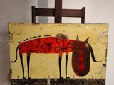 un tableau posé sur un chevalet représentant une vache