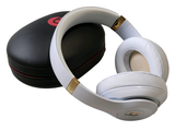 a pair of headphones sitting on top of a black case