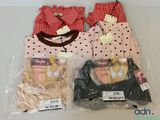 three bags of underwear and a bag of bras on a table