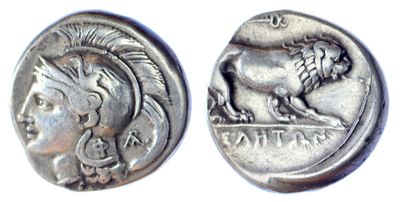 a close up of a coin with a lion on it