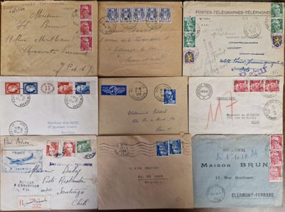 several old envelopes are stacked on top of each other on a table