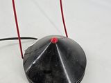 an image of a black and red lamp on a white surface