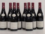 six bottles of red wine are lined up in a row