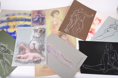 many different types of art work displayed on a table