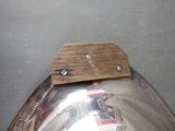a close up of a watch with a wooden strap on it