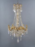 Lustre à 9 bras de lumières en métal doré à décor d'arabesqu…