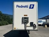 a white box truck with a pay meter on the back of it