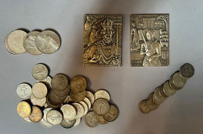 a lot of coins that are sitting on a table