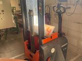 a picture of a forklift in a garage