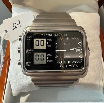 a close up of a watch in a box with a price tag