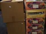 several boxes of food are stacked on pallets in a warehouse