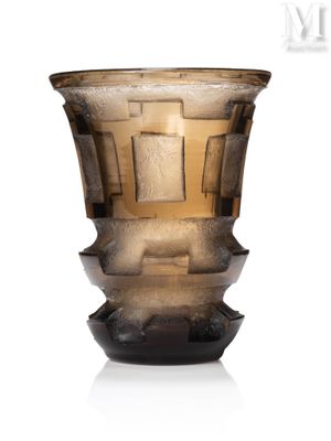 a glass vase that is sitting on a white surface