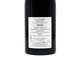 a bottle of wine that is sitting on a table