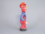 figurine of a man with a red hat and a blue shirt