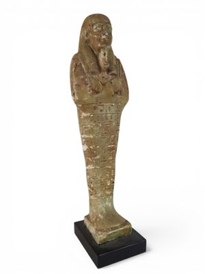 an egyptian statue of a woman holding a bowl of food