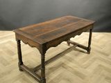 an image of a wooden table on a parquet floor