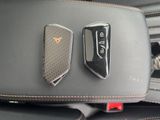 the interior of a car with two remote controls and a seat belt