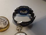 two watches sitting next to each other on a table