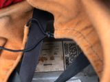 a close up of a baseball glove with a ticket in it