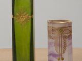 two vases sitting next to each other on a table
