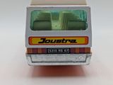 a toy bus that is sitting on a white surface