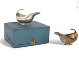 a small blue box with a silver bird on it and a small blue box with a silver bird on it