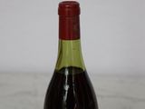 a bottle of wine that is sitting on a table