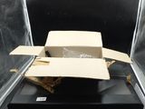 a box that is sitting on top of a black table