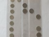 a close up of a plastic bag filled with coins on top of a table