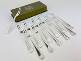 six forks and six knives in a green box