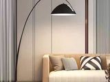 a living room with a couch and a table with a lamp on it