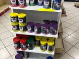 a display of paint on a shelf in a store