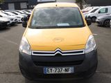 a yellow van that is parked in a parking lot