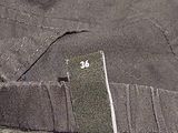 a close up of a piece of clothing with a tag on it