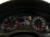 a close up of a car dashboard with a speedometer and gauges