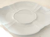 a white plate that is sitting on a table