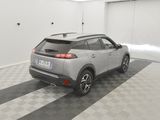the rear end of a silver suv parked in a garage