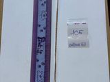 a picture of a purple ribbon with a tag on it