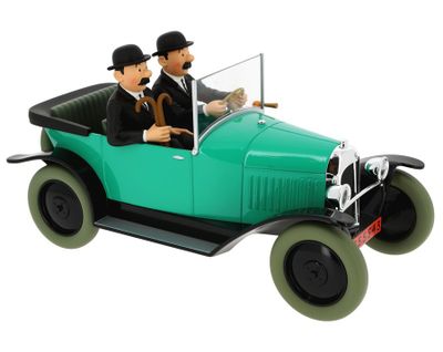 two figurines of two men in a green car