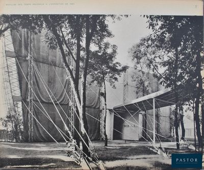 black and white photograph of an old photo of a tent in the woods