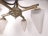 a picture of a chandelier with three glass shades
