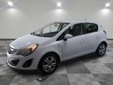 a picture of a white car parked in a garage